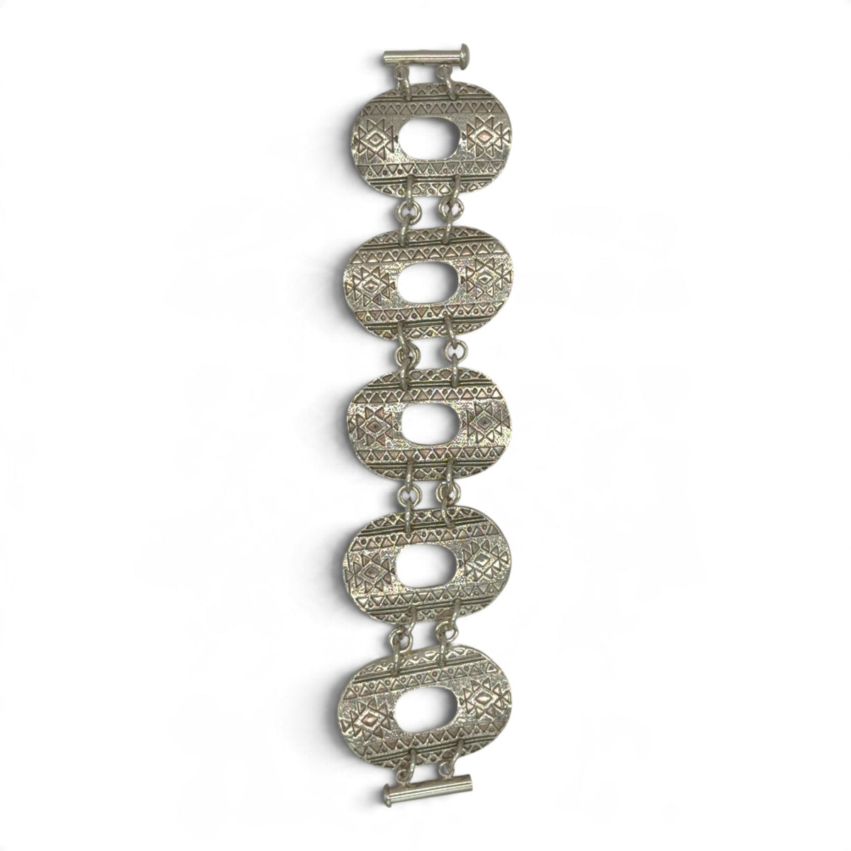 Aztec Rhythm sterling silver bracelet with five geometric textured links and slide clasp