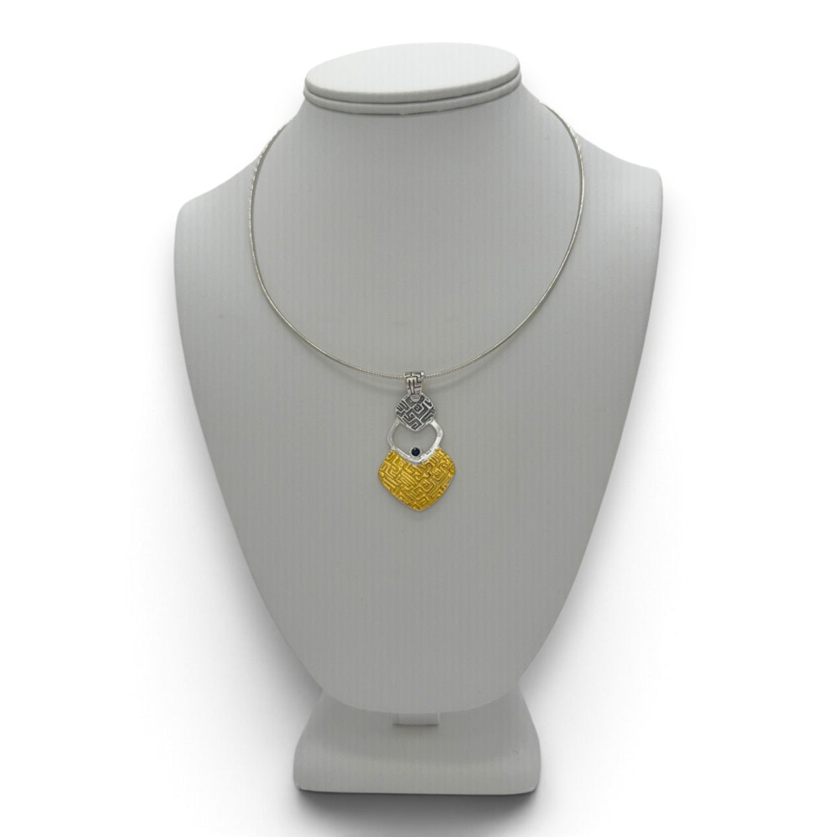Silver Rhythm fine silver pendant displayed on a jewelry bust