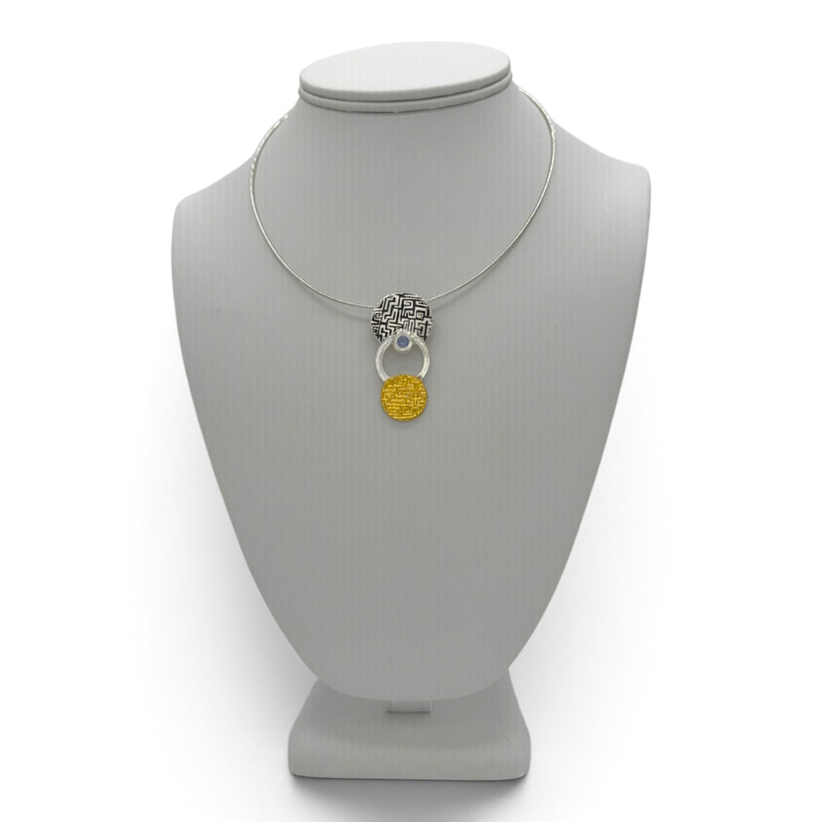 Golden Cascade fine silver pendant displayed on a jewelry bust