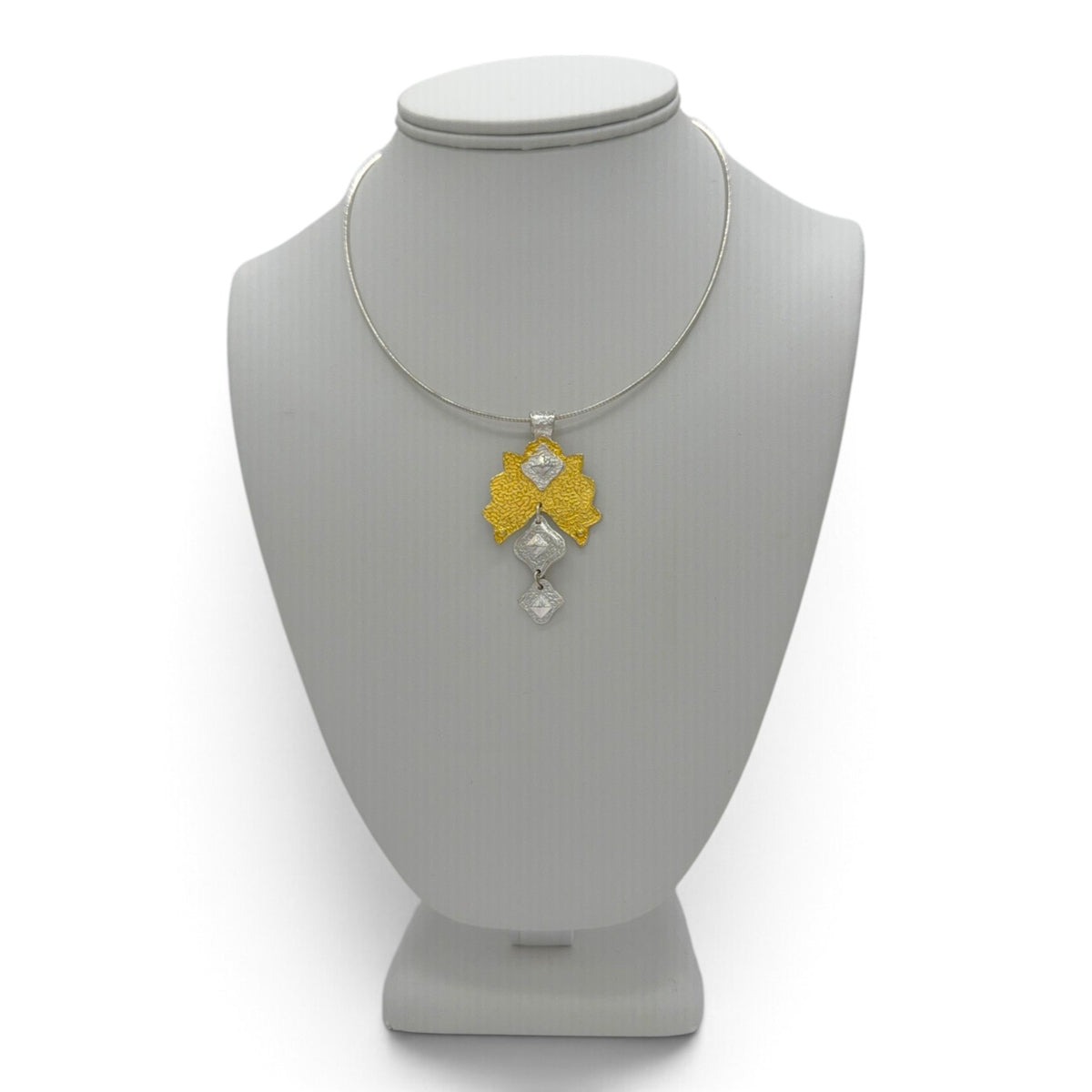 Golden Canopy fine silver pendant displayed on a jewelry bust