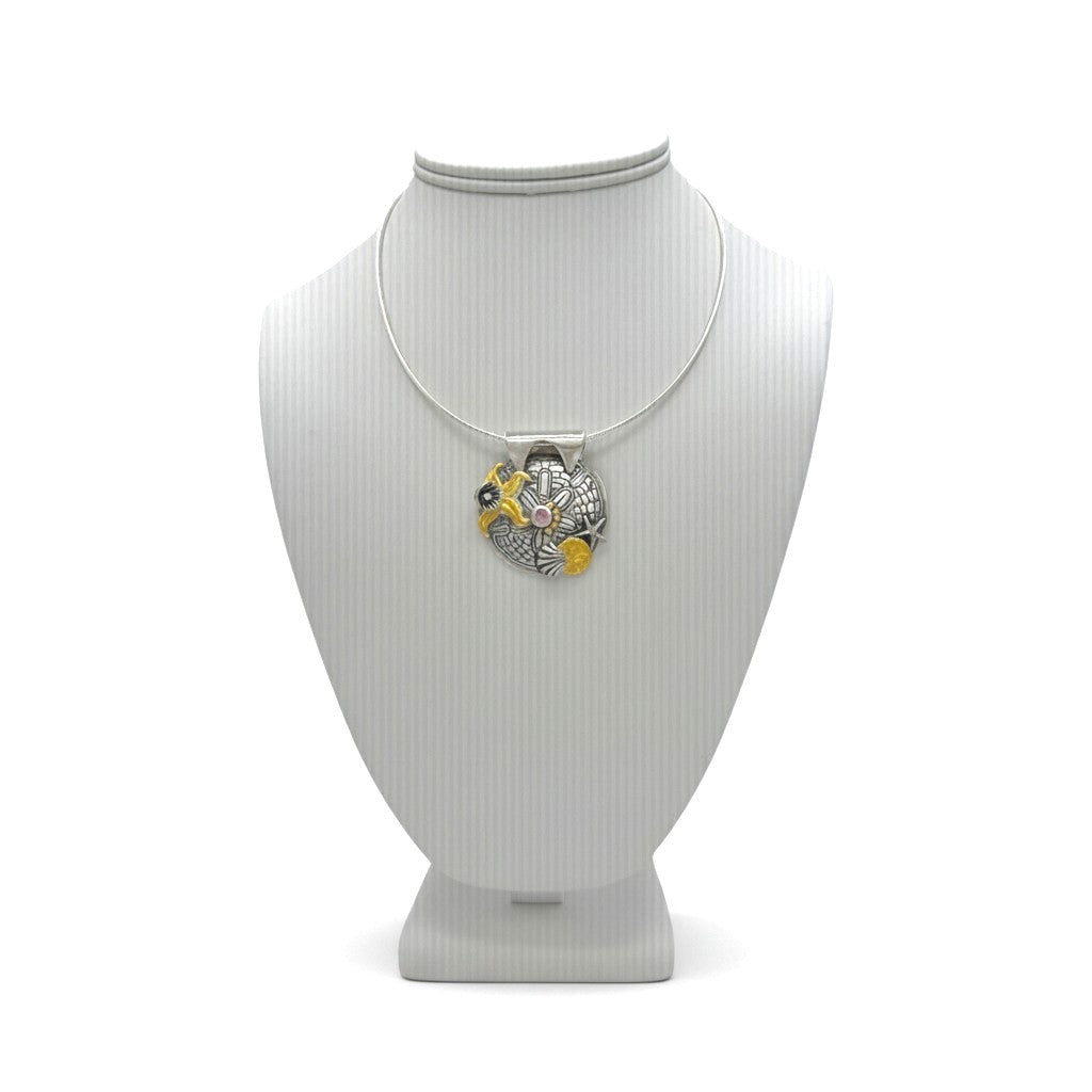 Tidal Treasures fine silver pendant displayed on a jewelry bust