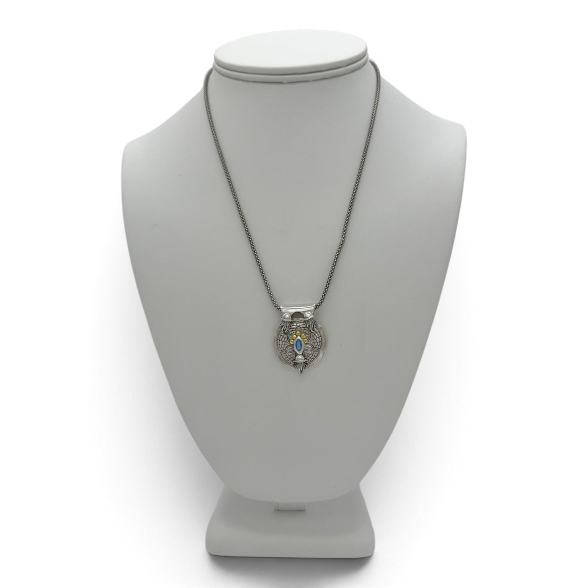 Tidal Drift fine silver pendant displayed on a jewelry bust