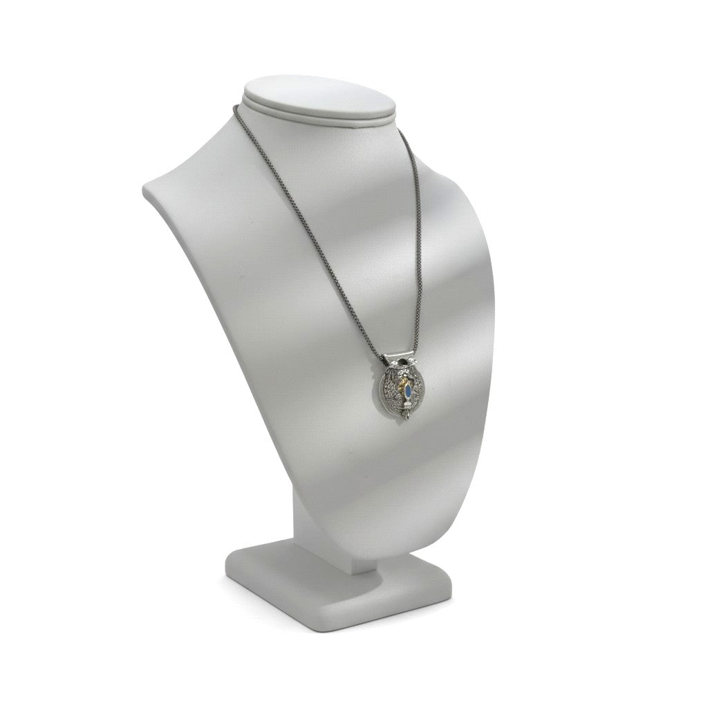 Tidal Drift pendant lifestyle view with fine silver, oxidized details and light blue spinel