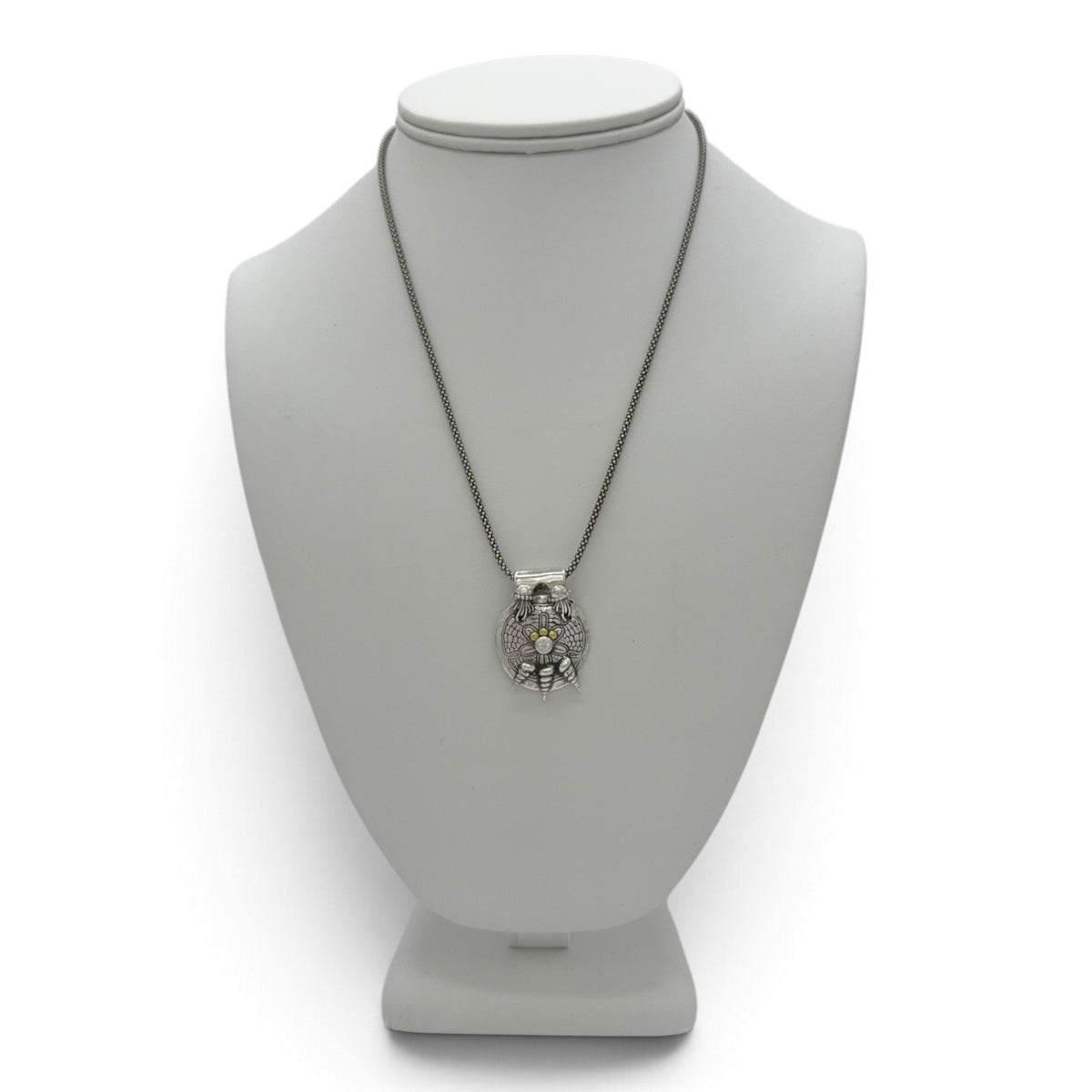 Sea Drift fine silver pendant displayed on a jewelry bust